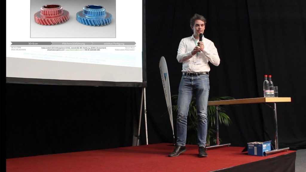 Swann Rack with presentation slides on stage at Fabcon Rapid Tech